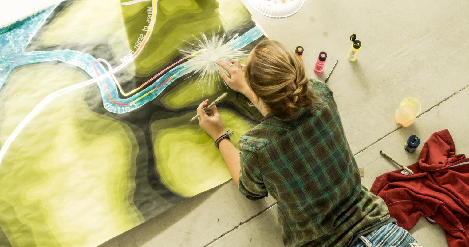 woman painting on the floor