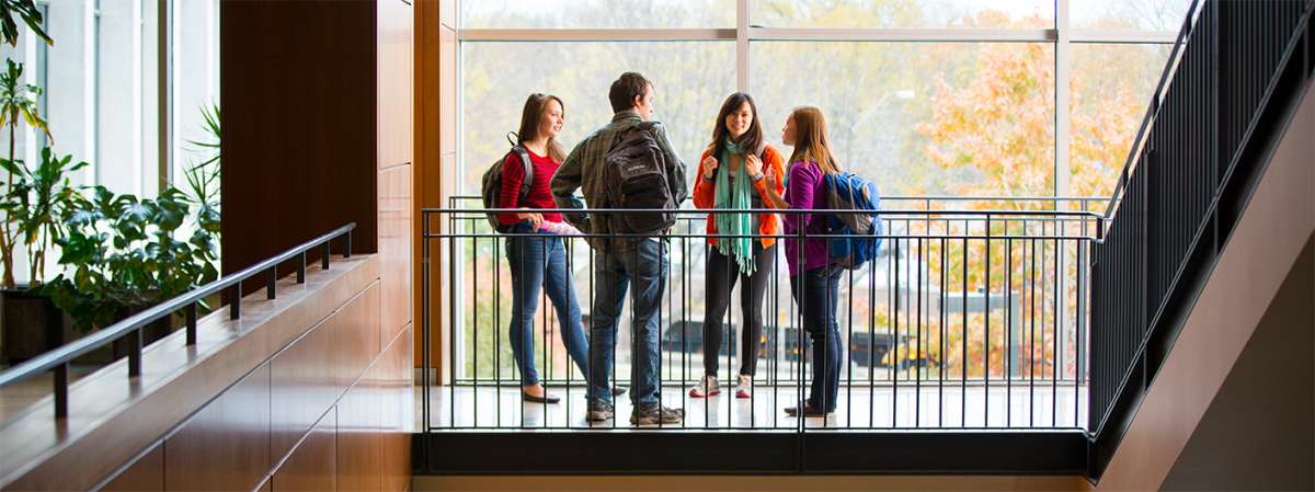 People by railing talking